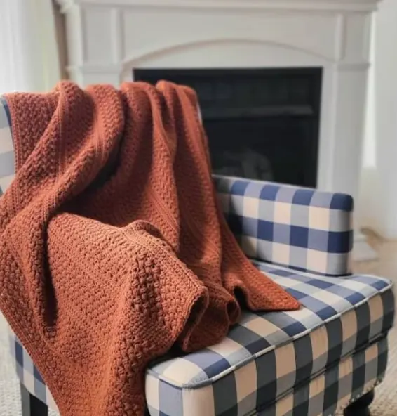 crochet blanket pattern on a gingham chair