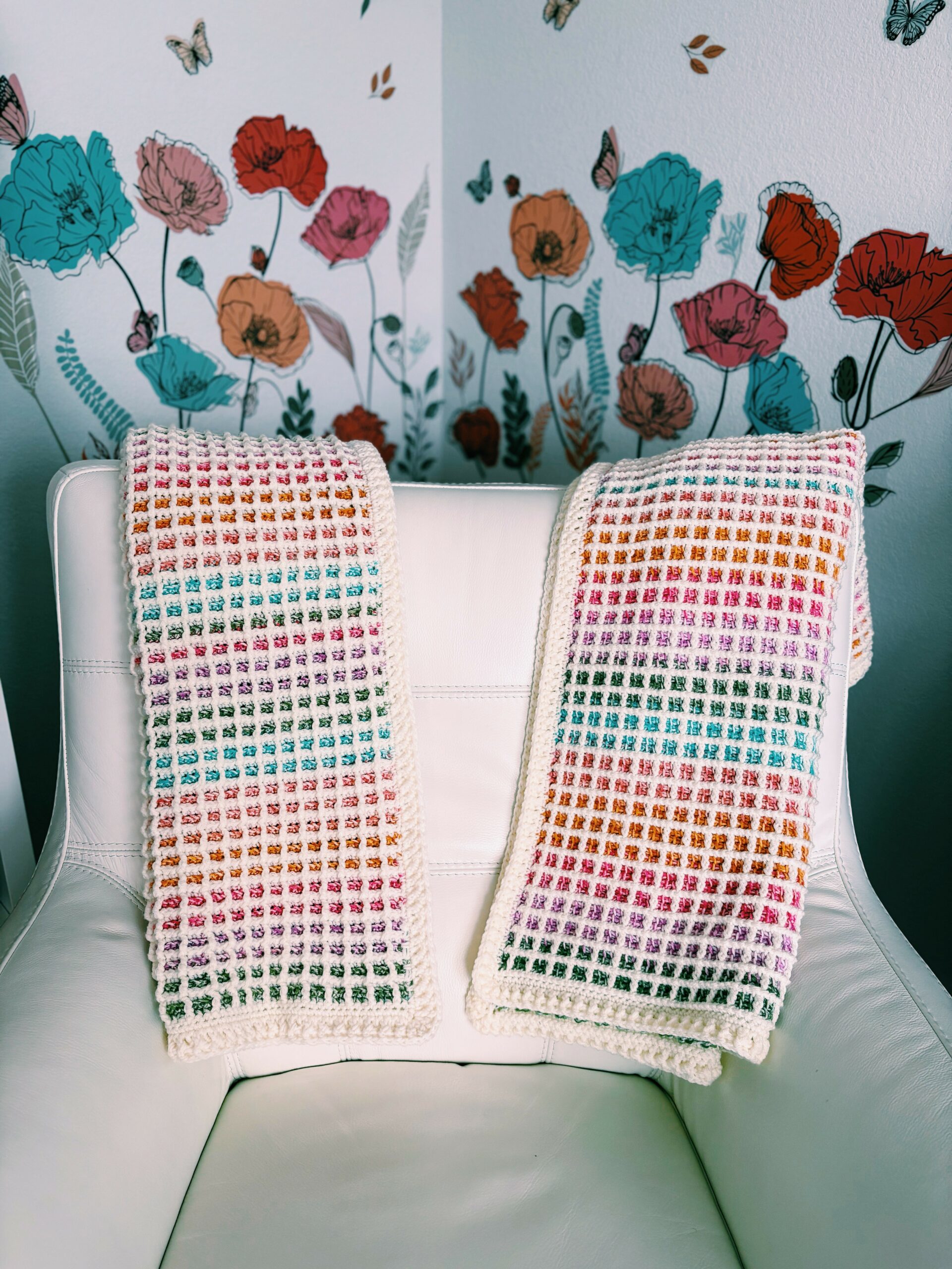 Close-up of waffle stitch baby blanket in pastel self-striping yarn