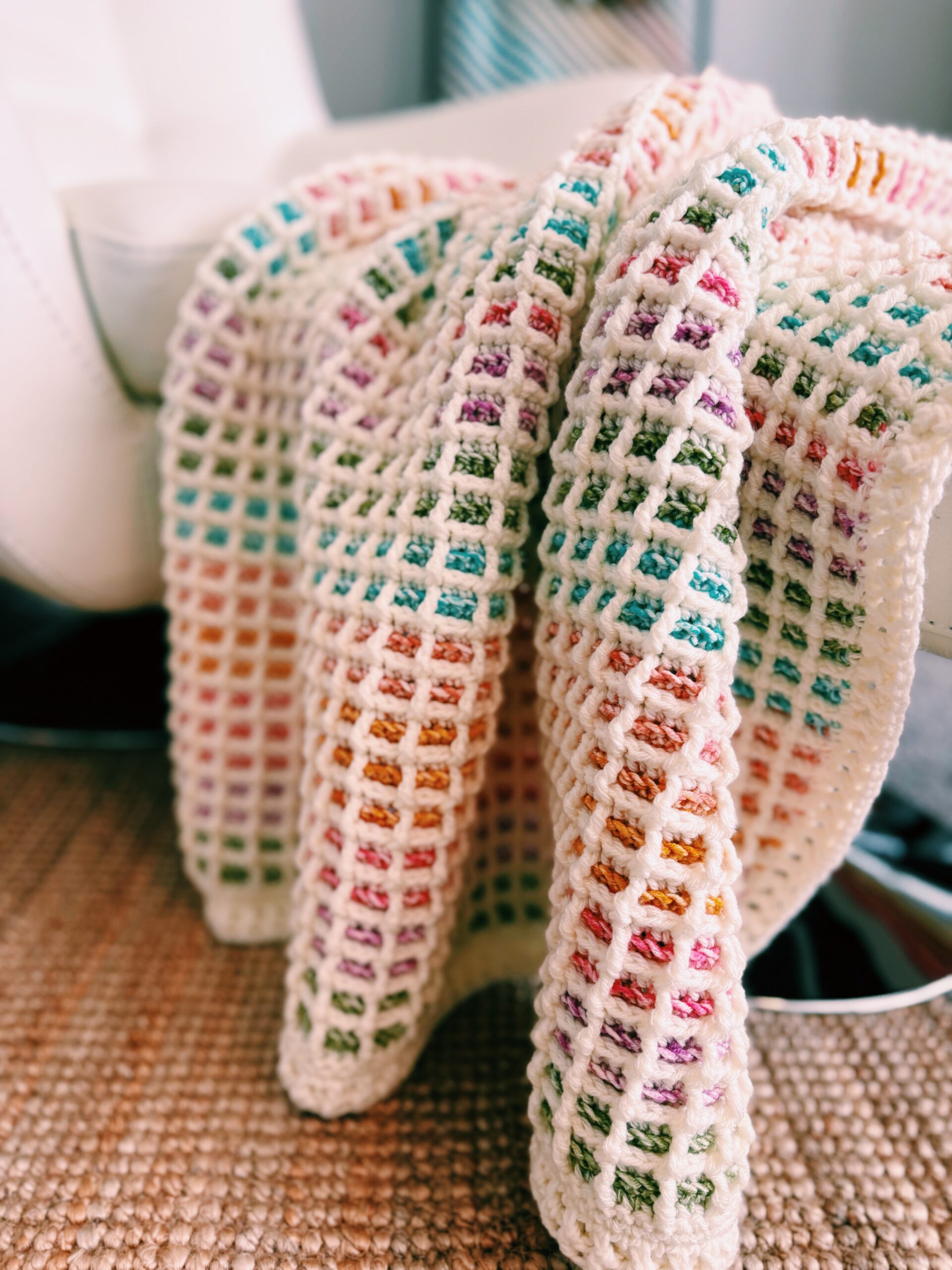 Emmy Blanket draped over a chair, highlighting waffle texture and color changes