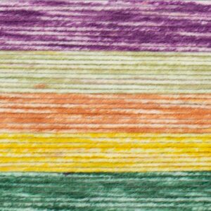 Close-up of yarn strands arranged horizontally in bands of purple, beige, orange, yellow, and green, showing the texture and fibers of the Felicity Blanket in a stunning interlocking shell stitch crochet blanket pattern.