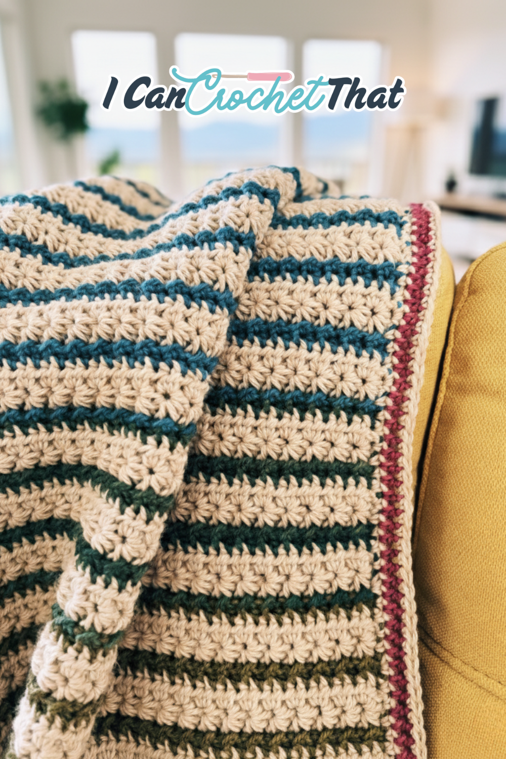 Crochet afghan with alternating star stitch rows in cream and warm autumn tones.