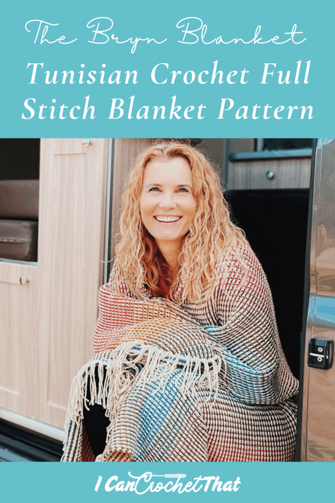 A smiling woman sits at the entrance of a camper wrapped in a multicolored crochet blanket; text reads Tunisian Crochet Full Stitch Blanket Pattern.
