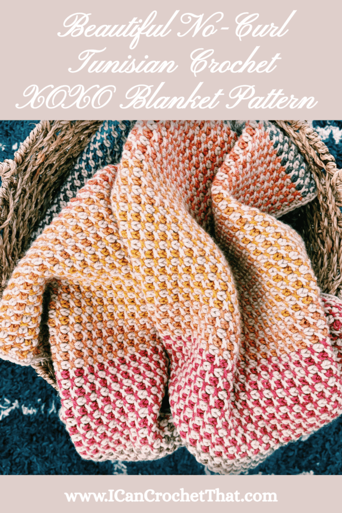 A multicolored Tunisian crochet blanket with a no-curl pattern is displayed draped over a woven basket; text promotes the XOXO blanket pattern and website.